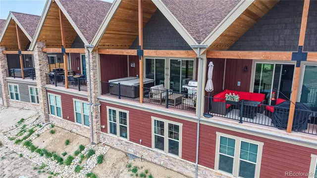 a view of a house with wooden fence