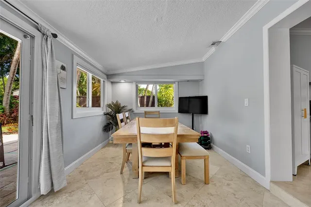 a room with furniture and flat screen tv