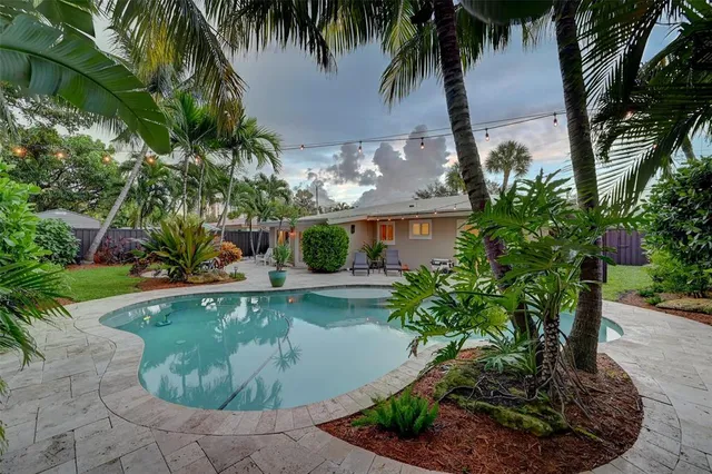 a view of a backyard with a patio
