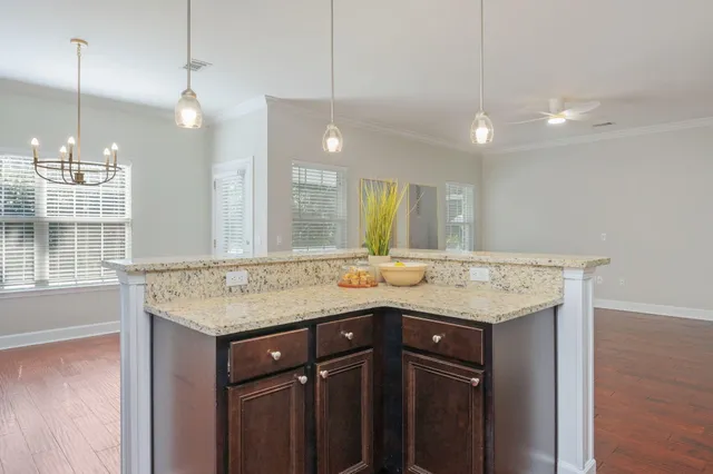 a bathroom with a granite countertop sink a large mirror and a shower