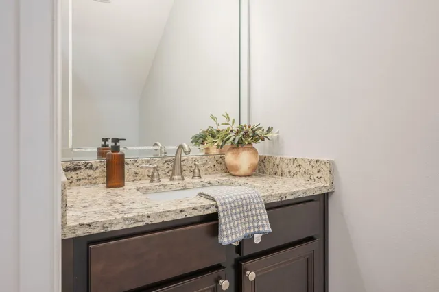 a dining table with chairs and cabinets