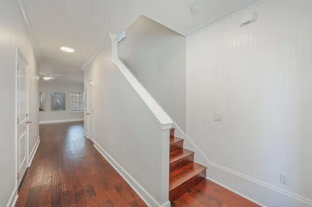 a view of entryway and hall with wooden floor