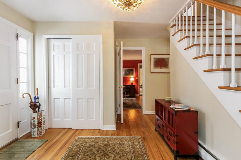 3 Wilson Ridge Road East Darien, CT 06820 - Photo 3 of 26 a view of an entryway with wooden floor and a livingroom view