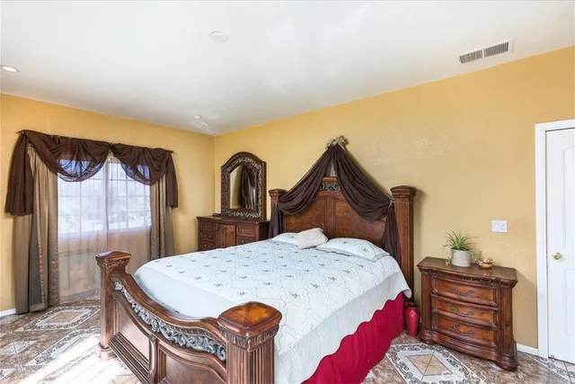 a spacious bathroom with a granite countertop tub sink and mirror