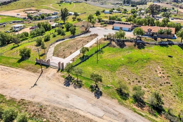 an aerial view of a house with yard swimming pool and outdoor seating