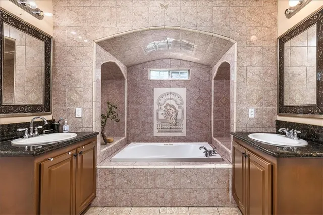 a bedroom with bed and wooden floor