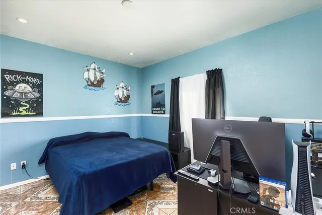 a bathroom with a toilet and a shower curtain