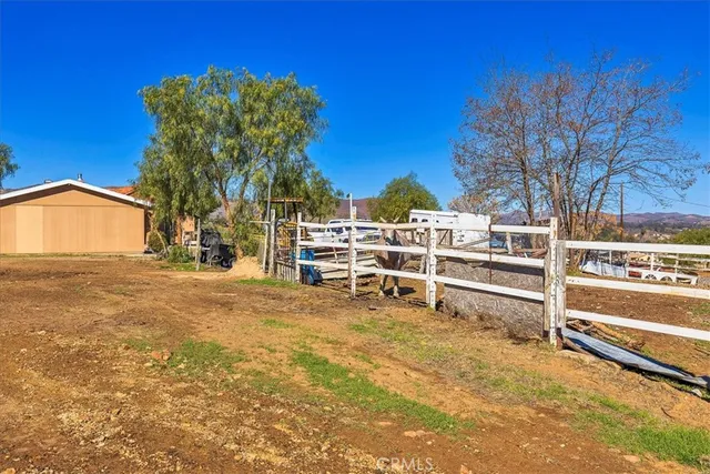 a view of walk in closet with clothes
