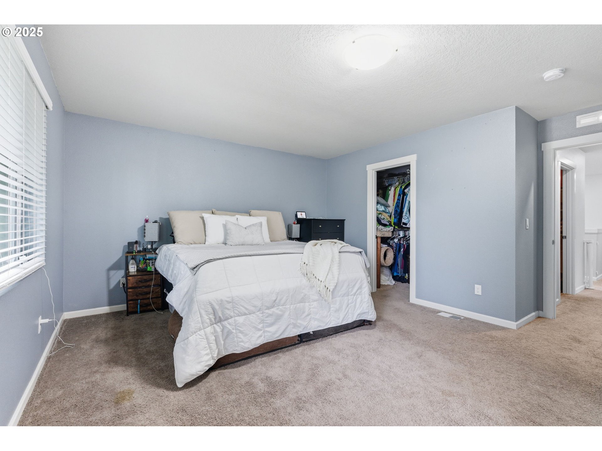 476 Southwest 15th Avenue Canby, OR 97013 - Photo 29 of 43 a bedroom with a bed and a large window