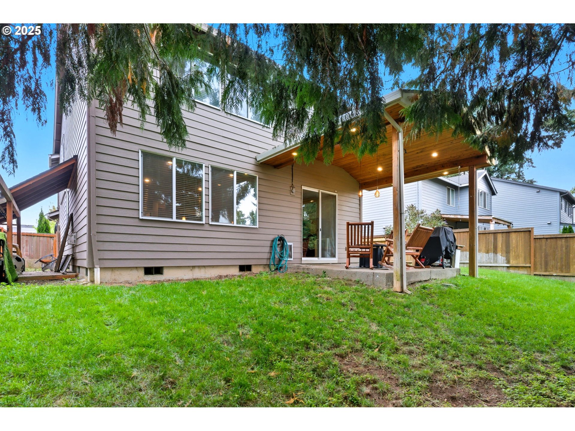 476 Southwest 15th Avenue Canby, OR 97013 - Photo 40 of 43 a view of a house with a yard and sitting area