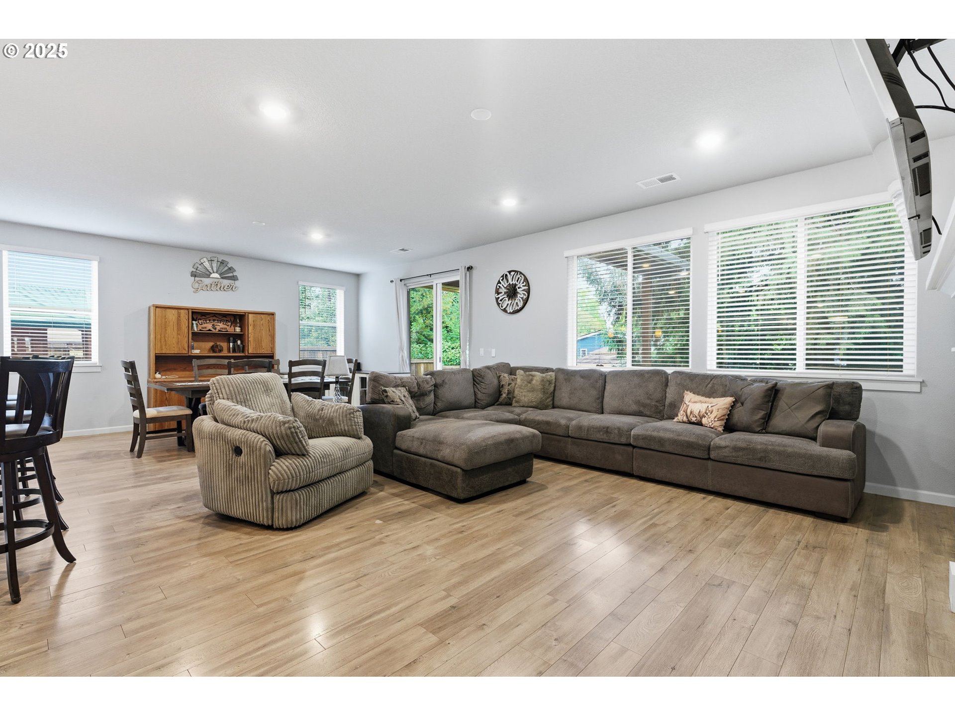 476 Southwest 15th Avenue Canby, OR 97013 - Photo 8 of 43 a living room with furniture and a flat screen tv