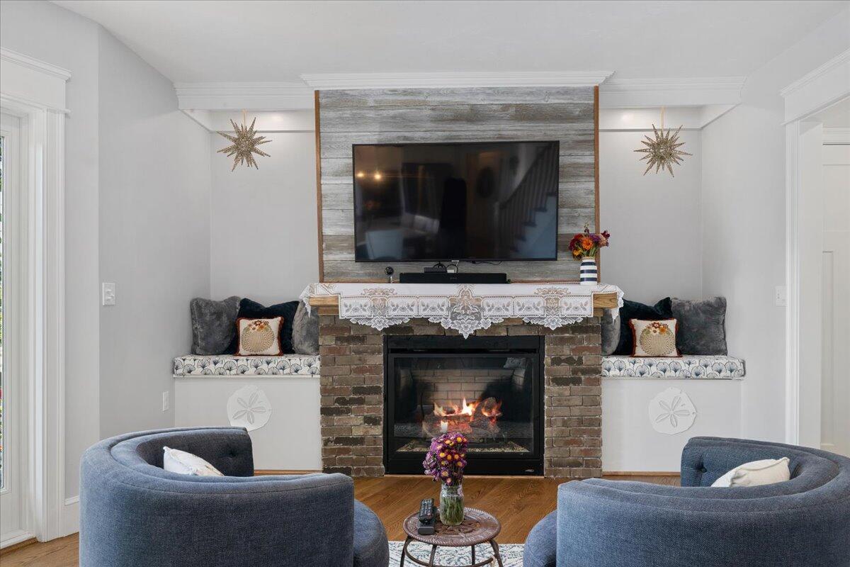 31 Amy Brown Road Mashpee, MA 02649 - Photo 11 of 95 a living room with furniture and a fireplace