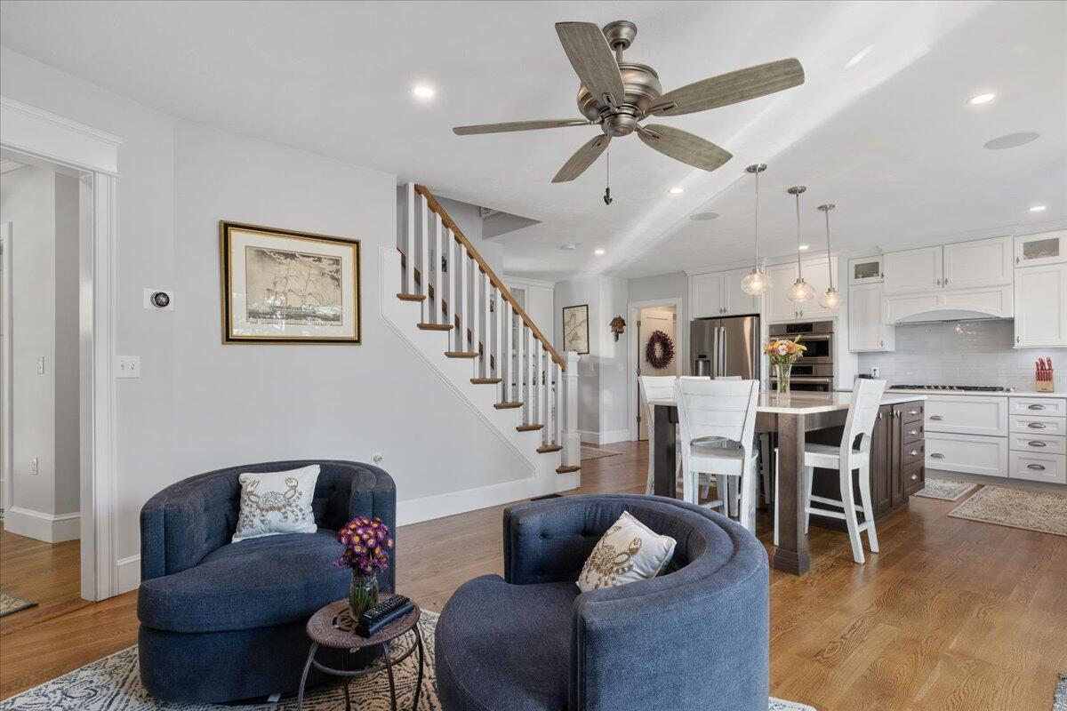 31 Amy Brown Road Mashpee, MA 02649 - Photo 13 of 95 a living room with furniture kitchen view and a wooden floor