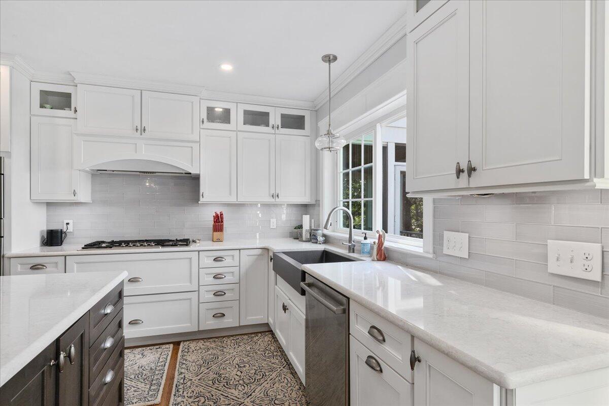 31 Amy Brown Road Mashpee, MA 02649 - Photo 16 of 95 a kitchen with stainless steel appliances granite countertop a sink and cabinets with wooden floor