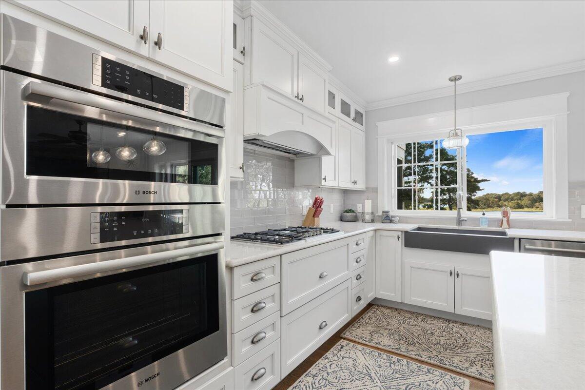 31 Amy Brown Road Mashpee, MA 02649 - Photo 19 of 95 a kitchen with stainless steel appliances granite countertop a stove and cabinets