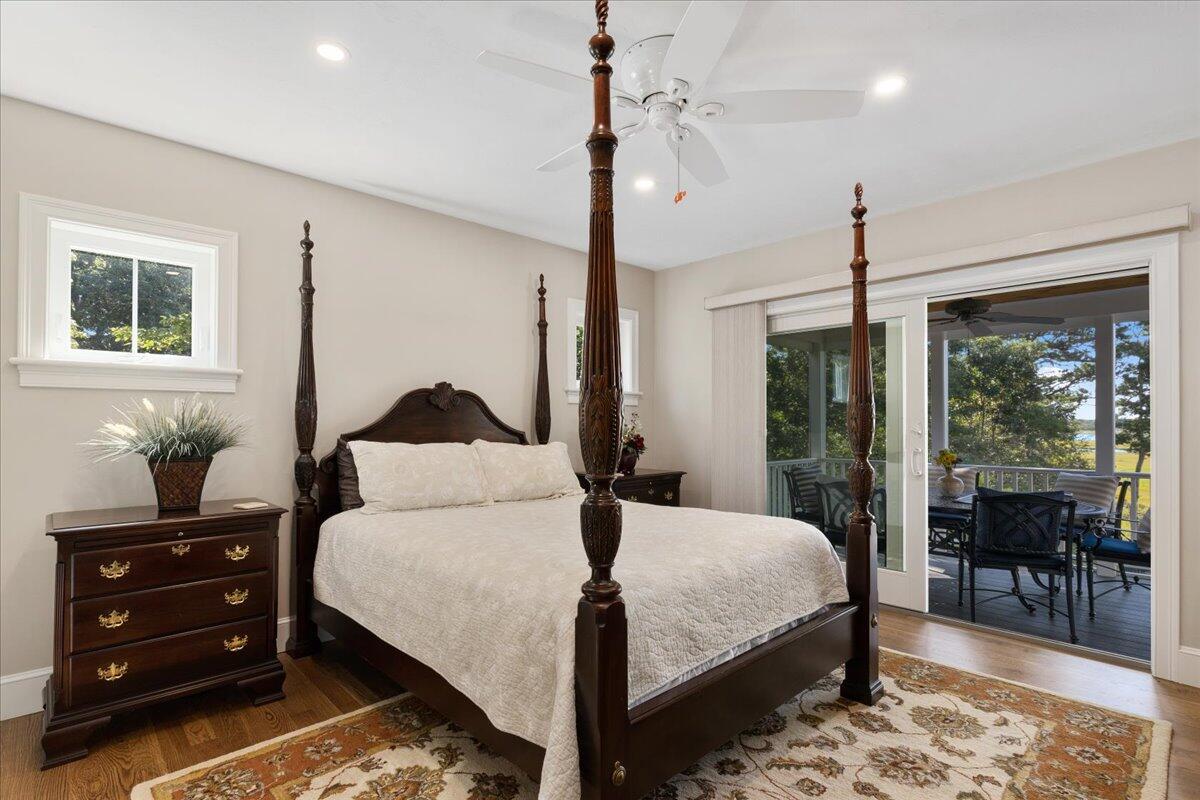 31 Amy Brown Road Mashpee, MA 02649 - Photo 23 of 95 a bedroom with a large bed and a chandelier