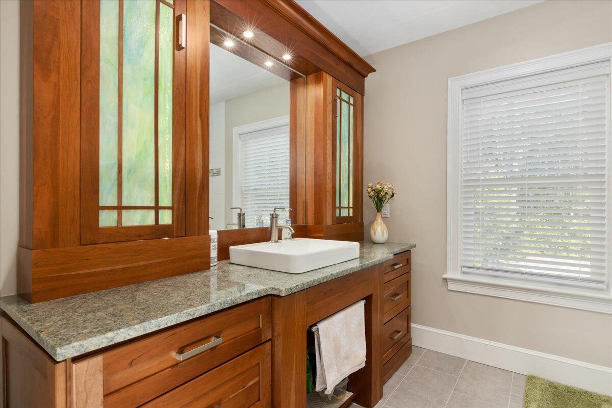 31 Amy Brown Road Mashpee, MA 02649 - Photo 27 of 95 a bathroom with a granite countertop sink and a mirror