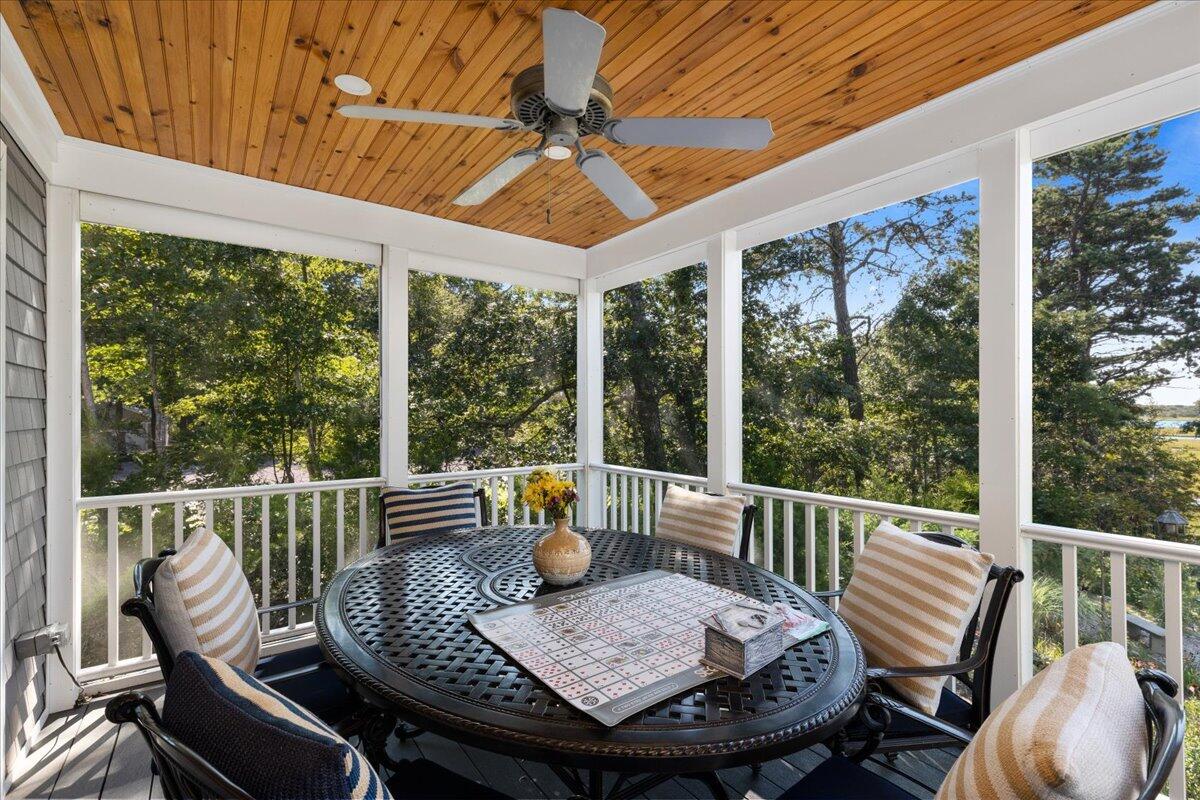 31 Amy Brown Road Mashpee, MA 02649 - Photo 30 of 95 a view of a patio with a table chairs and wooden fence