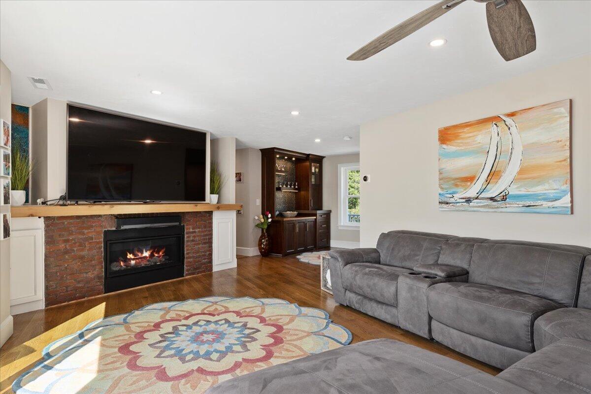 31 Amy Brown Road Mashpee, MA 02649 - Photo 34 of 95 a living room with furniture and a fireplace