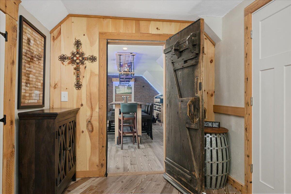 31 Amy Brown Road Mashpee, MA 02649 - Photo 52 of 95 a view of a hallway with wooden floor and windows