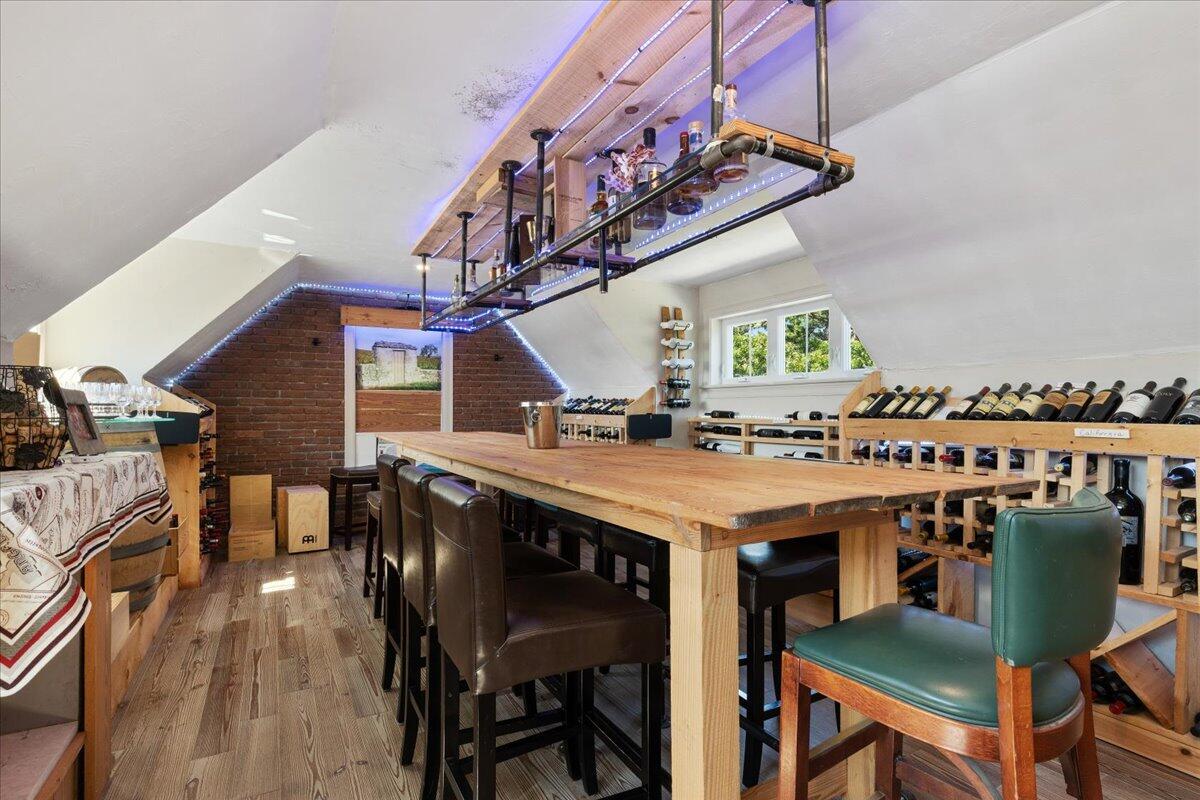 31 Amy Brown Road Mashpee, MA 02649 - Photo 58 of 95 a kitchen with stainless steel appliances granite countertop a dining table chairs and a oven