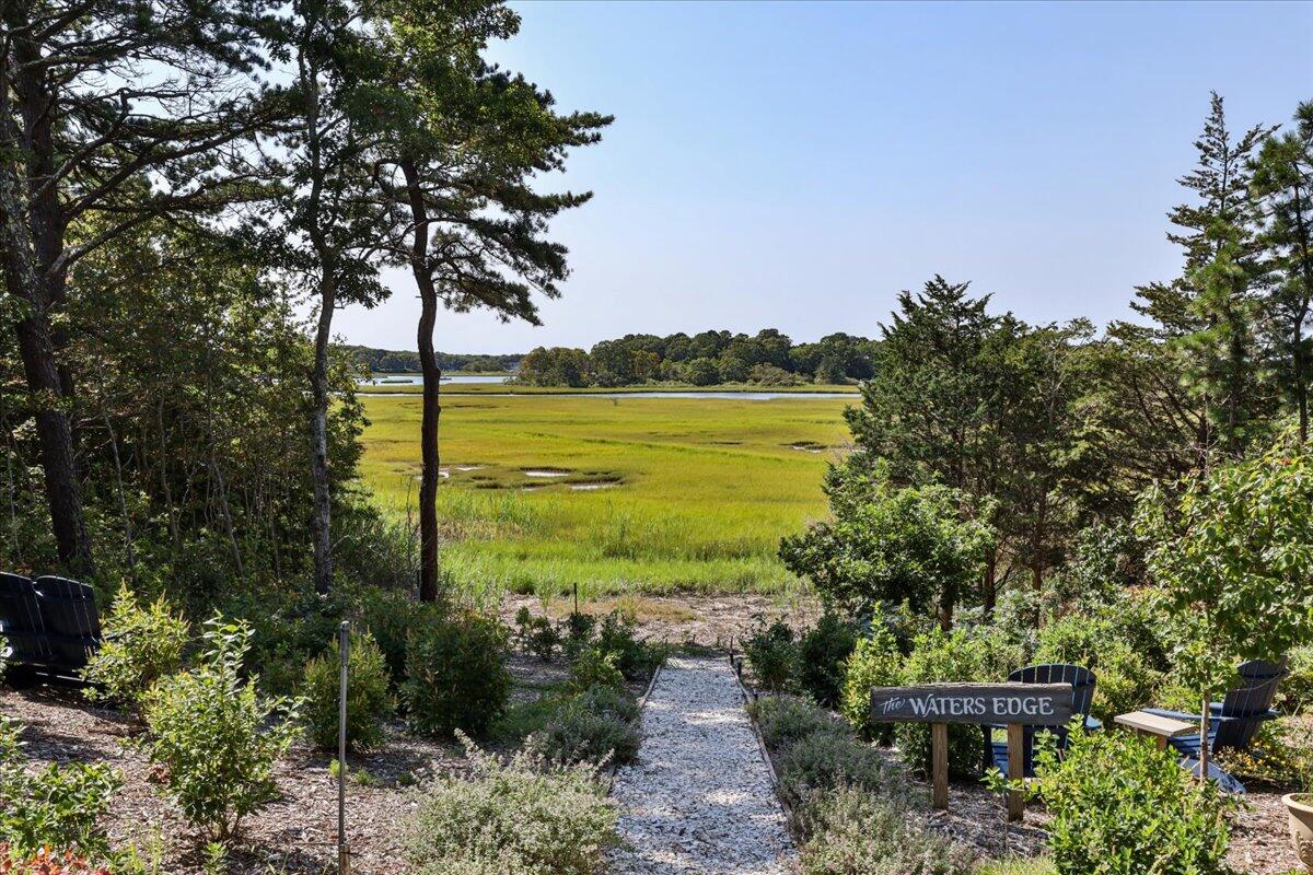 31 Amy Brown Road Mashpee, MA 02649 - Photo 69 of 95 a view of a lake with a garden