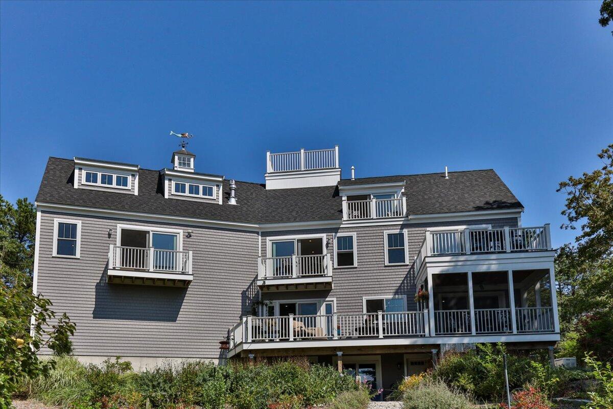 31 Amy Brown Road Mashpee, MA 02649 - Photo 71 of 95 a tall building with a lot of windows in it