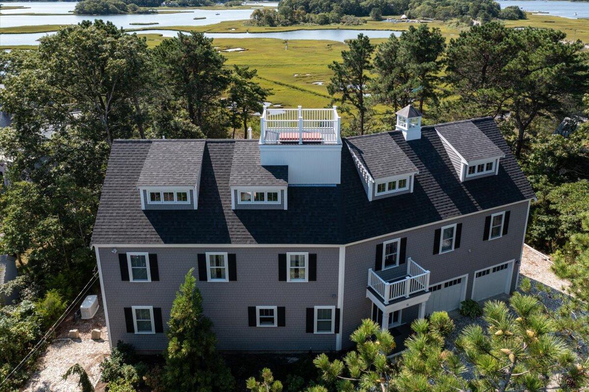 31 Amy Brown Road Mashpee, MA 02649 - Photo 74 of 95 an aerial view of a house with garden space and outdoor seating