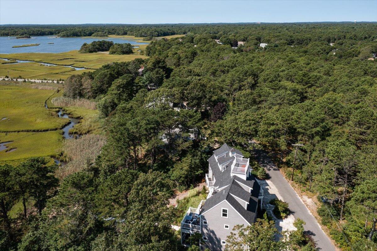 31 Amy Brown Road Mashpee, MA 02649 - Photo 81 of 95 an aerial view of a house with a lake view