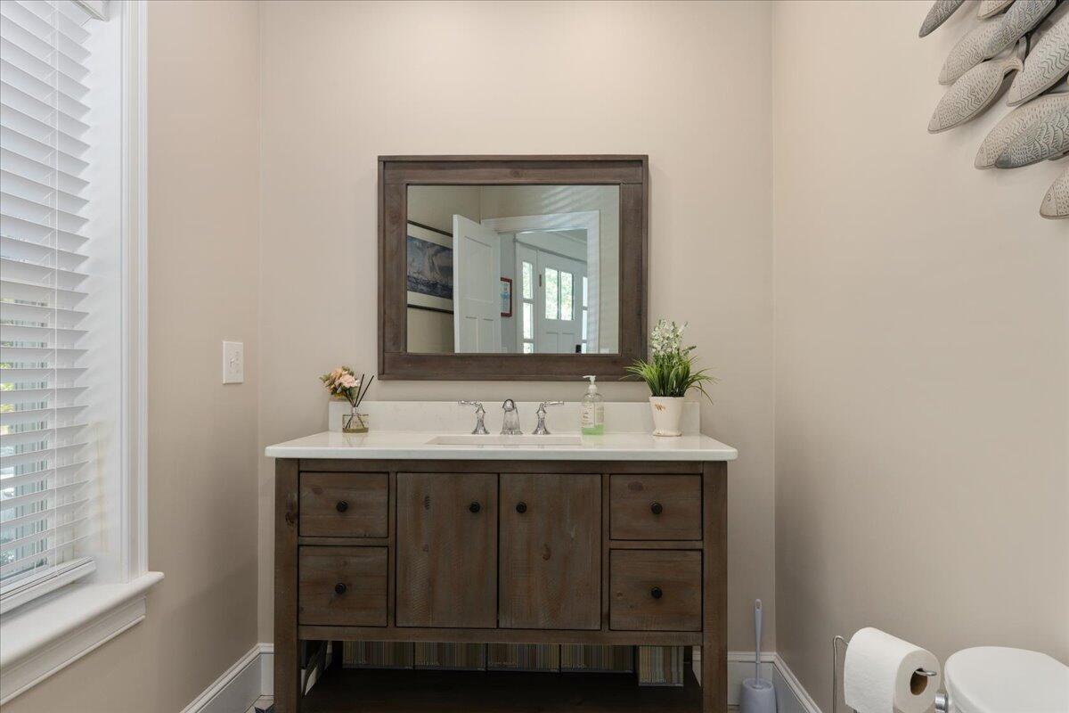 31 Amy Brown Road Mashpee, MA 02649 - Photo 9 of 95 a bathroom with a toilet sink and mirror
