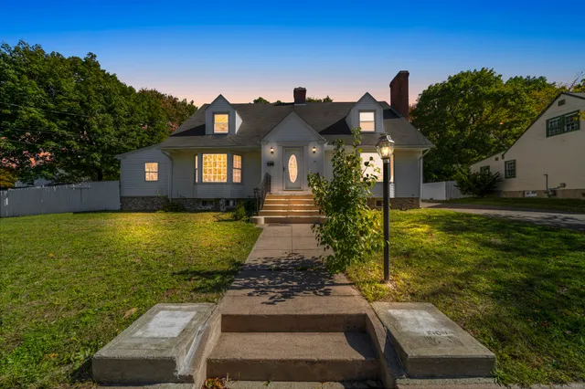 a front view of a house with garden