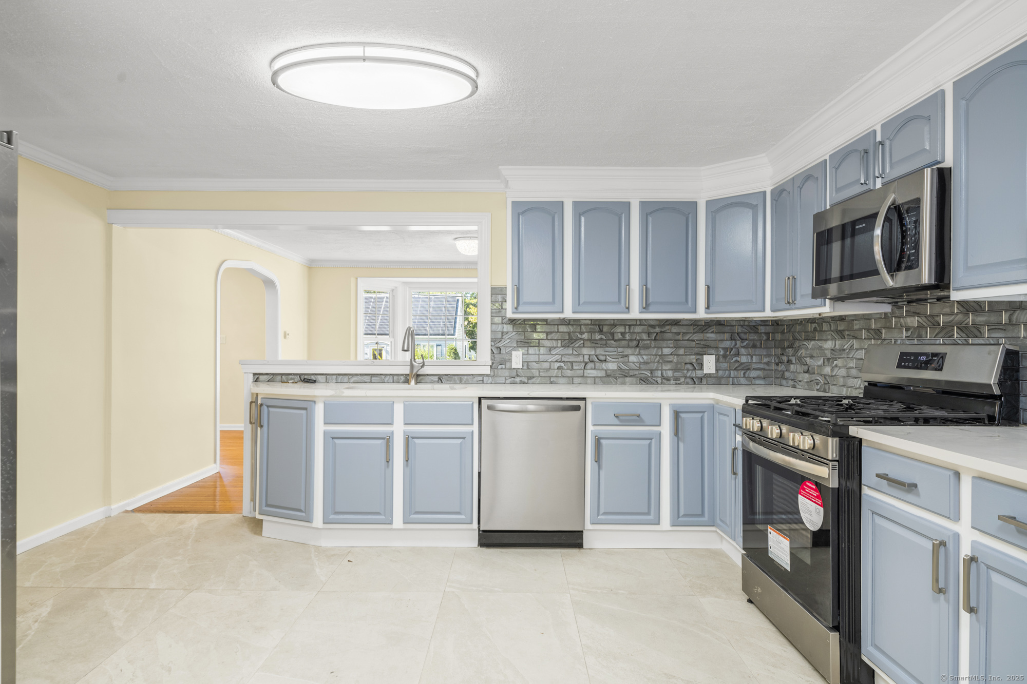 20 Rosina Road Hamden, CT 06514 - Photo 11 of 40 a kitchen with stainless steel appliances granite countertop a stove sink and cabinets