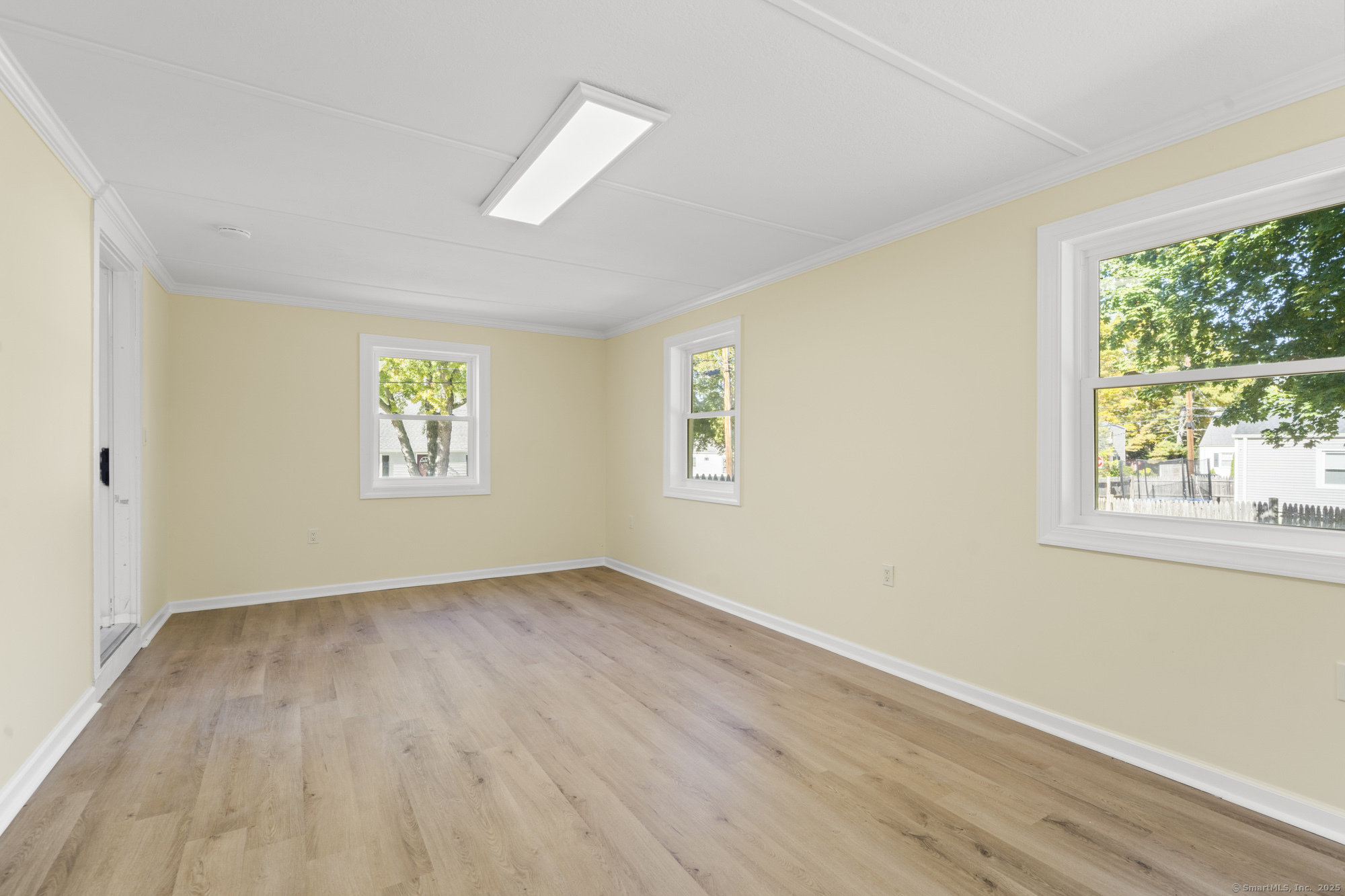 20 Rosina Road Hamden, CT 06514 - Photo 17 of 40 a view of an empty room with wooden floor and a window