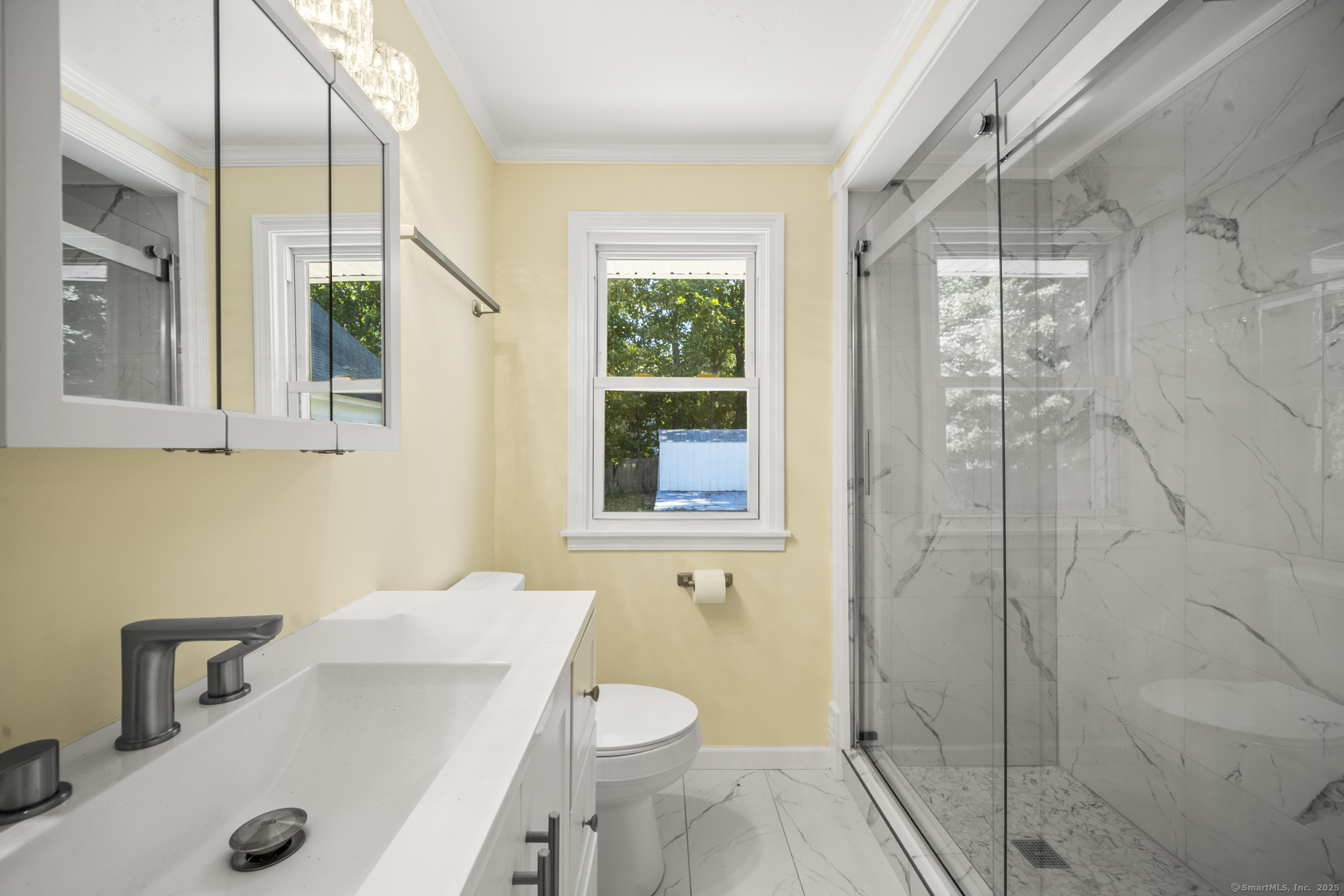 20 Rosina Road Hamden, CT 06514 - Photo 19 of 40 a bathroom with a sink a toilet window and shower