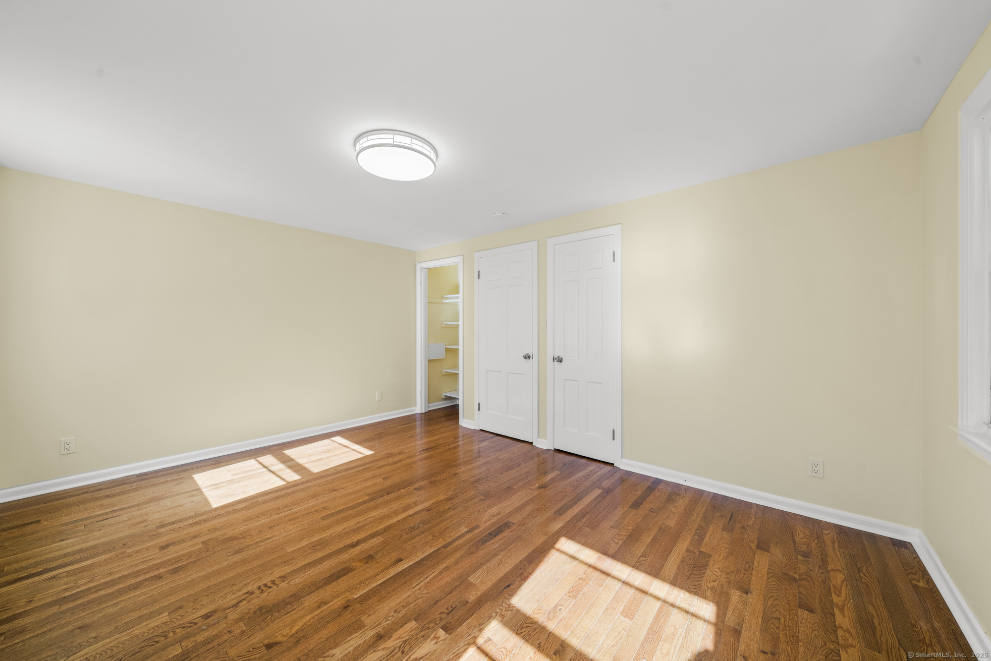 20 Rosina Road Hamden, CT 06514 - Photo 24 of 40 a view of an empty room with wooden floor and a window