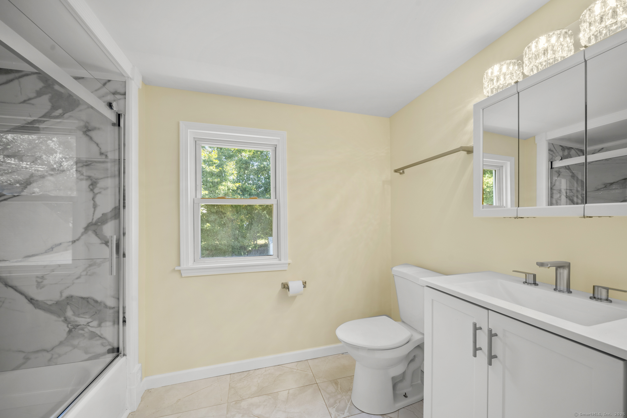 20 Rosina Road Hamden, CT 06514 - Photo 27 of 40 a bathroom with a sink a toilet and a shower