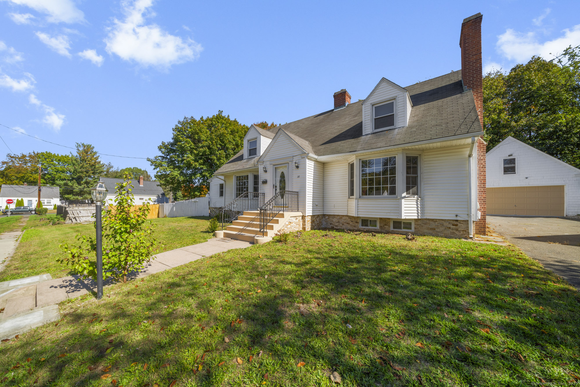20 Rosina Road Hamden, CT 06514 - Photo 3 of 40 a front view of house with yard and outdoor seating