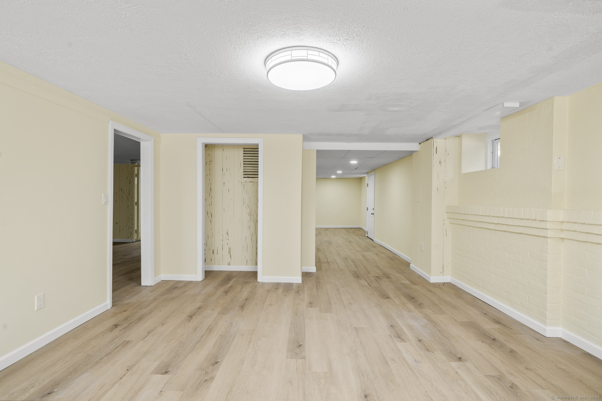 20 Rosina Road Hamden, CT 06514 - Photo 31 of 40 an empty room with wooden floor and windows