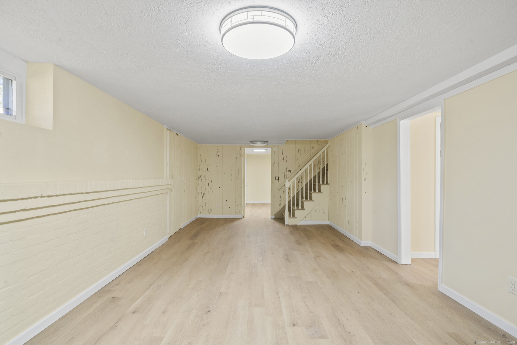 20 Rosina Road Hamden, CT 06514 - Photo 34 of 40 a view of an empty room with wooden floor and window