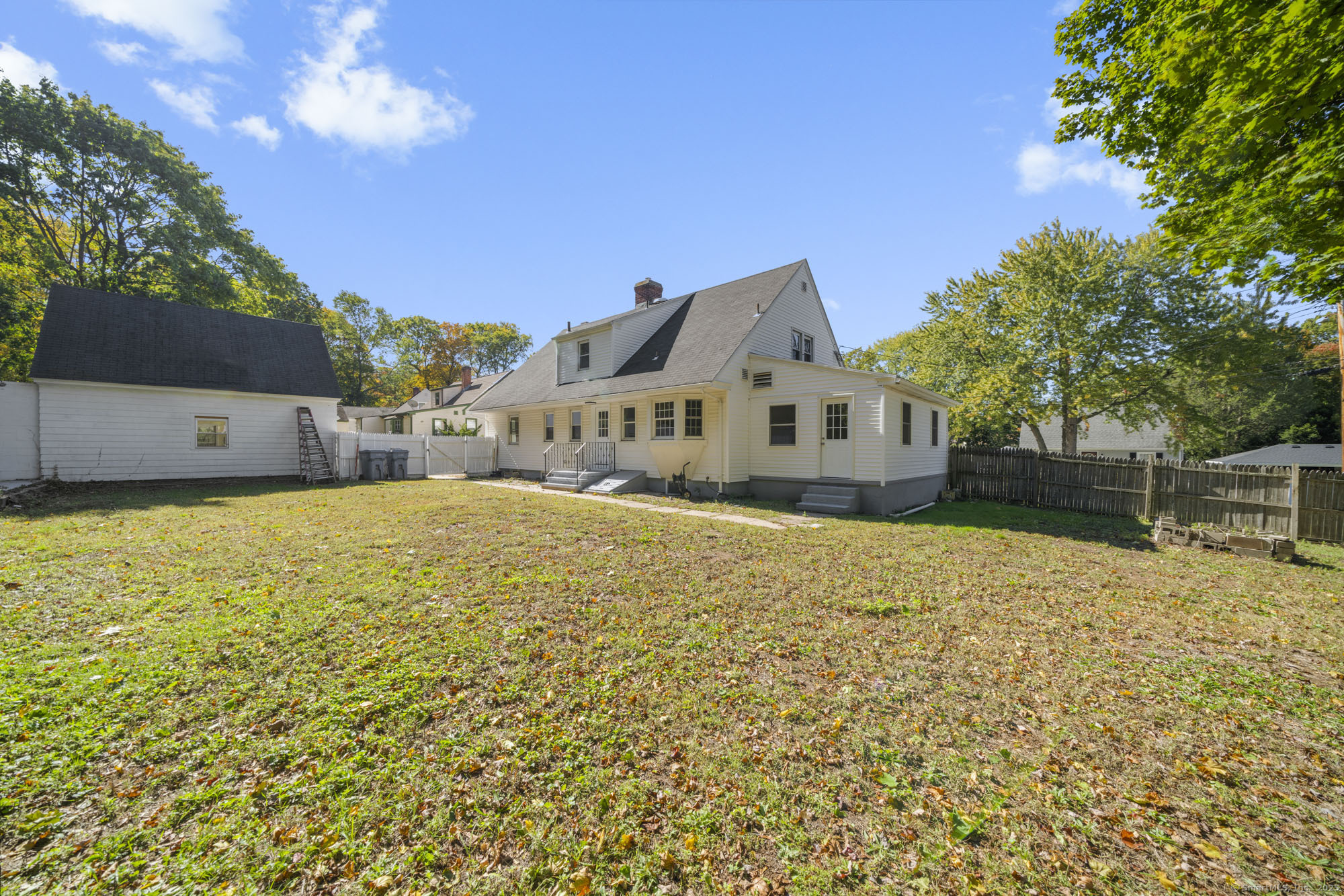 20 Rosina Road Hamden, CT 06514 - Photo 36 of 40 a large house with a large tree in front of it