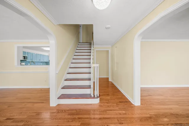 a view of entryway with wooden floor