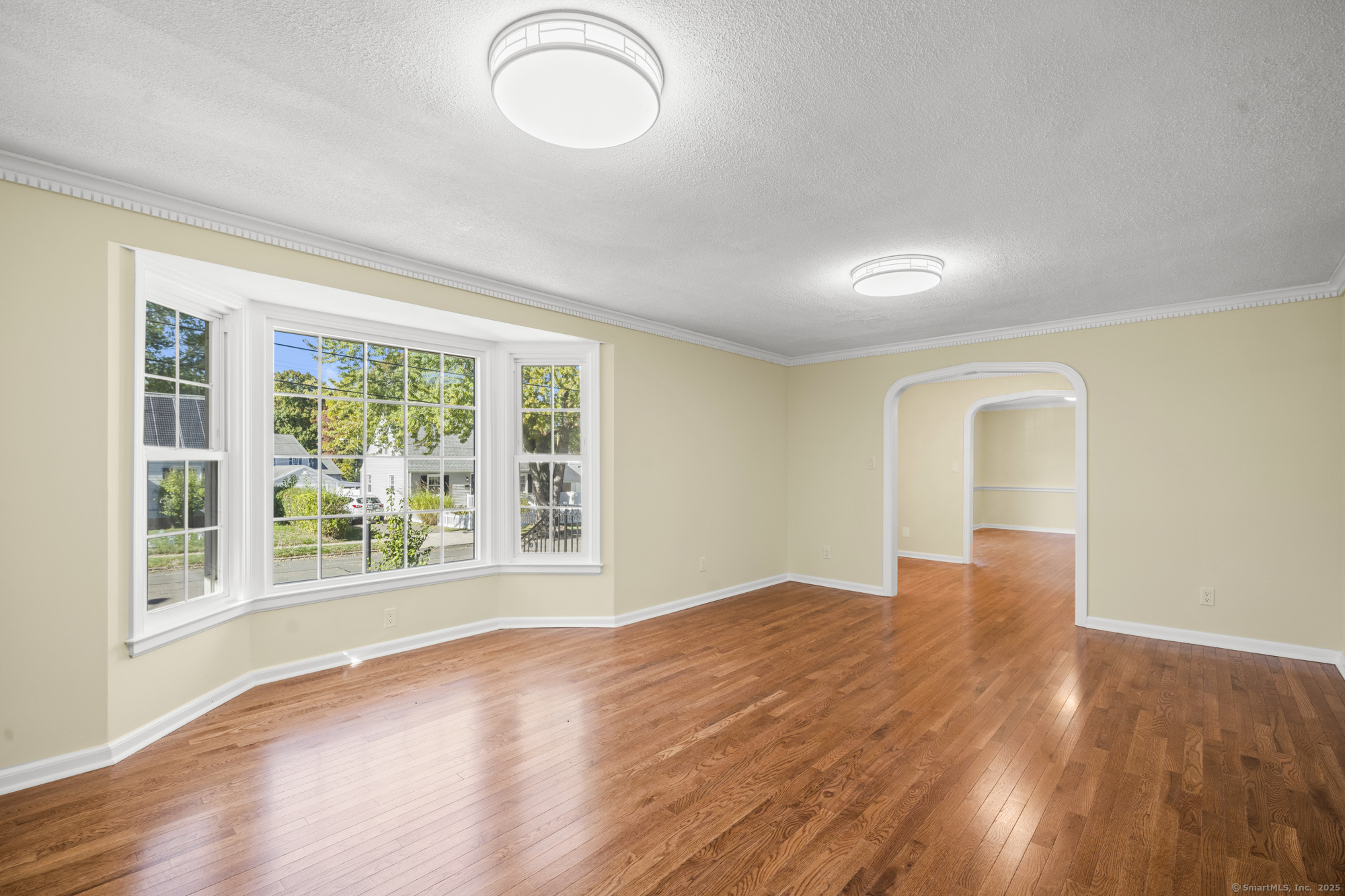 20 Rosina Road Hamden, CT 06514 - Photo 7 of 40 a view of an empty room with wooden floor and a window