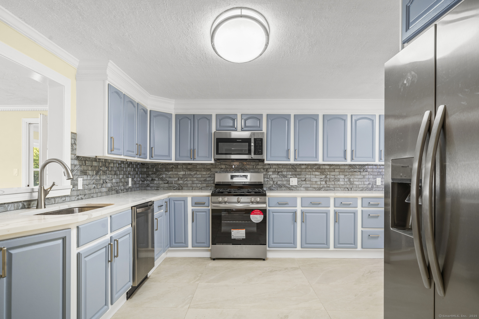 20 Rosina Road Hamden, CT 06514 - Photo 10 of 40 a kitchen with stainless steel appliances granite countertop a stove top oven a sink and a refrigerator