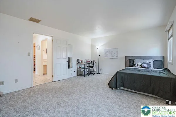 a room with furniture and a large window