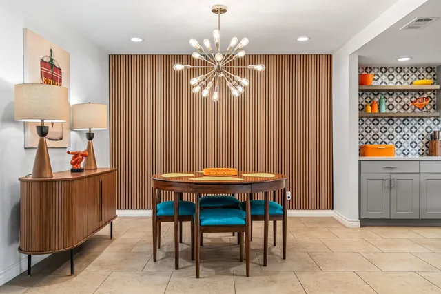 a dining room with furniture and window