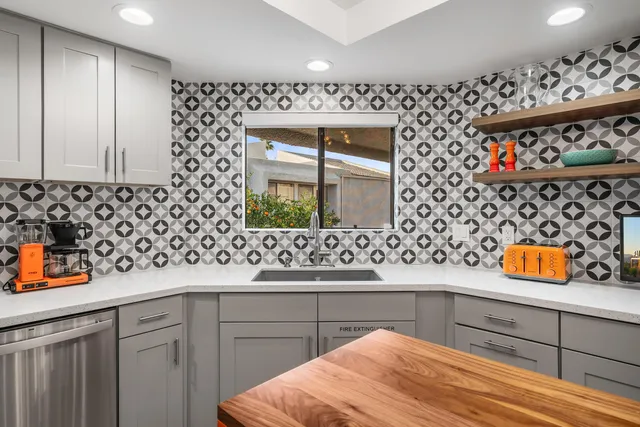 a kitchen with a sink and a window
