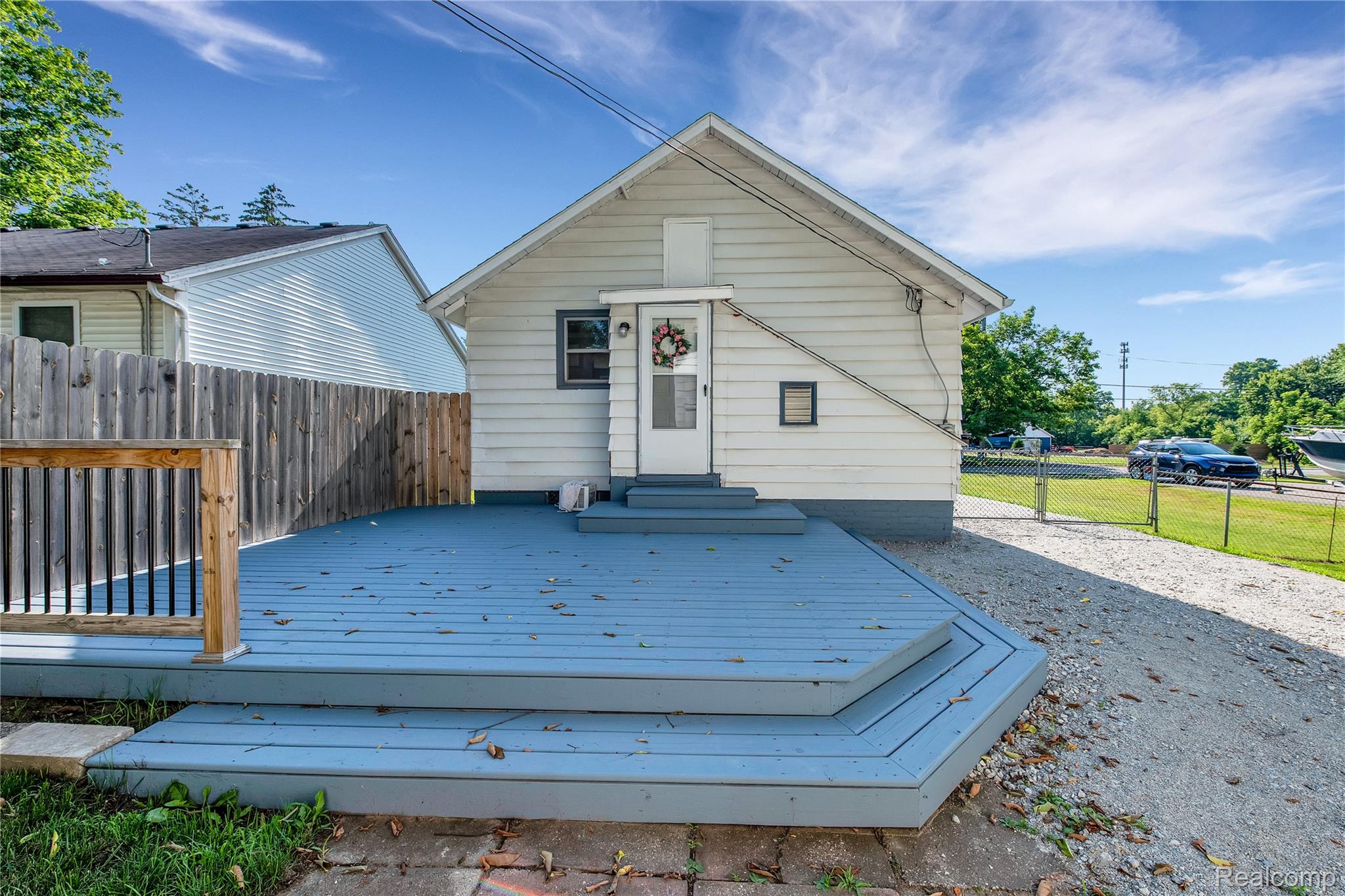 58925 Haven Ridge Road New Haven, MI 48048 - Photo 20 of 22 Rear view of house with a deck and entry steps