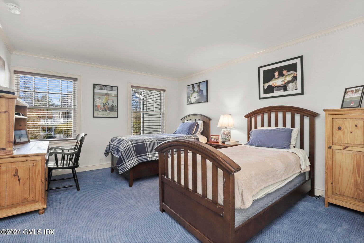1 Old Church Road, Unit 1 Greenwich, CT 06830 - Photo 12 of 17 a bedroom with a bed and a table in it
