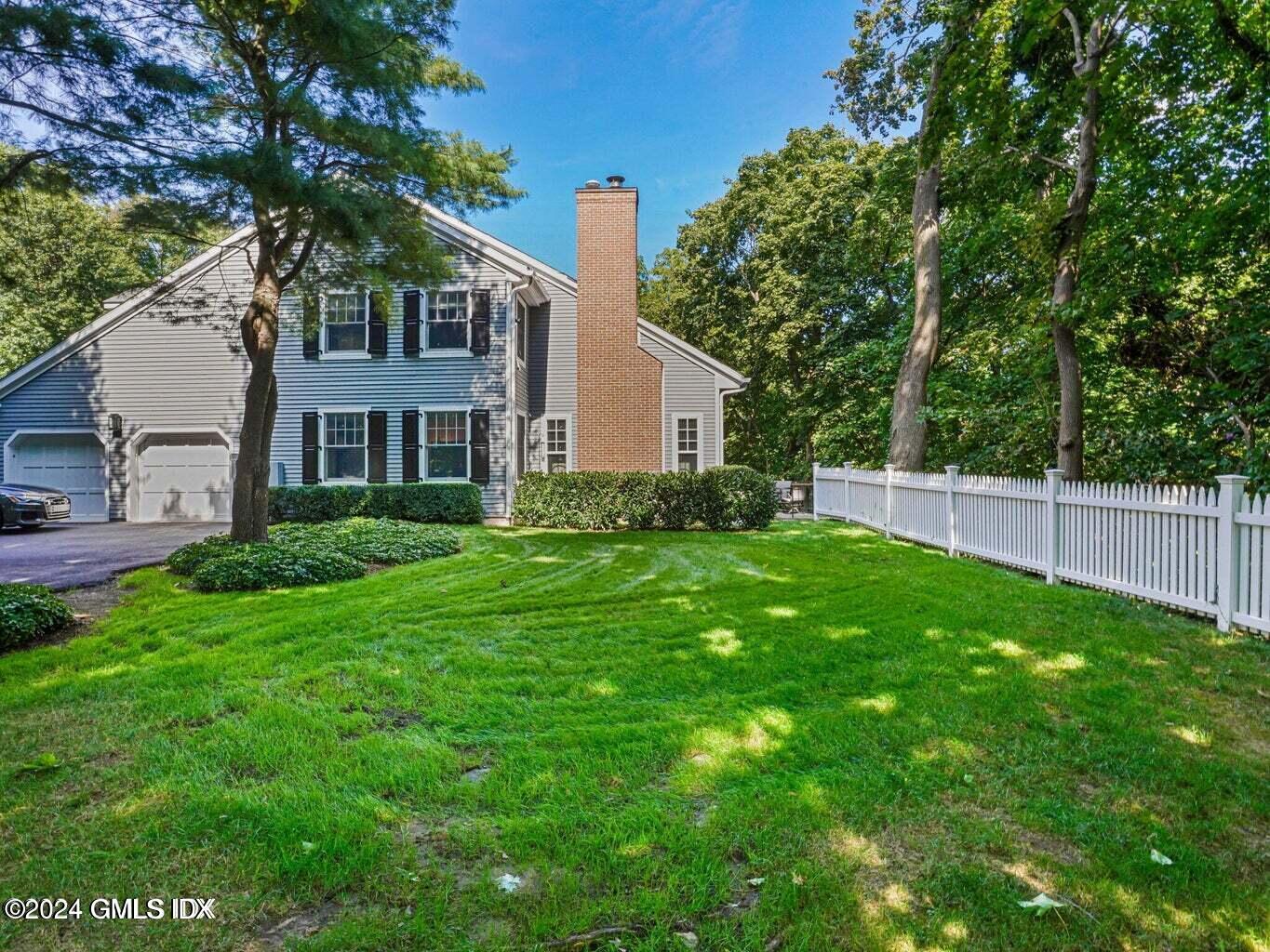 1 Old Church Road, Unit 1 Greenwich, CT 06830 - Photo 14 of 17 a view of a house with a yard and sitting area