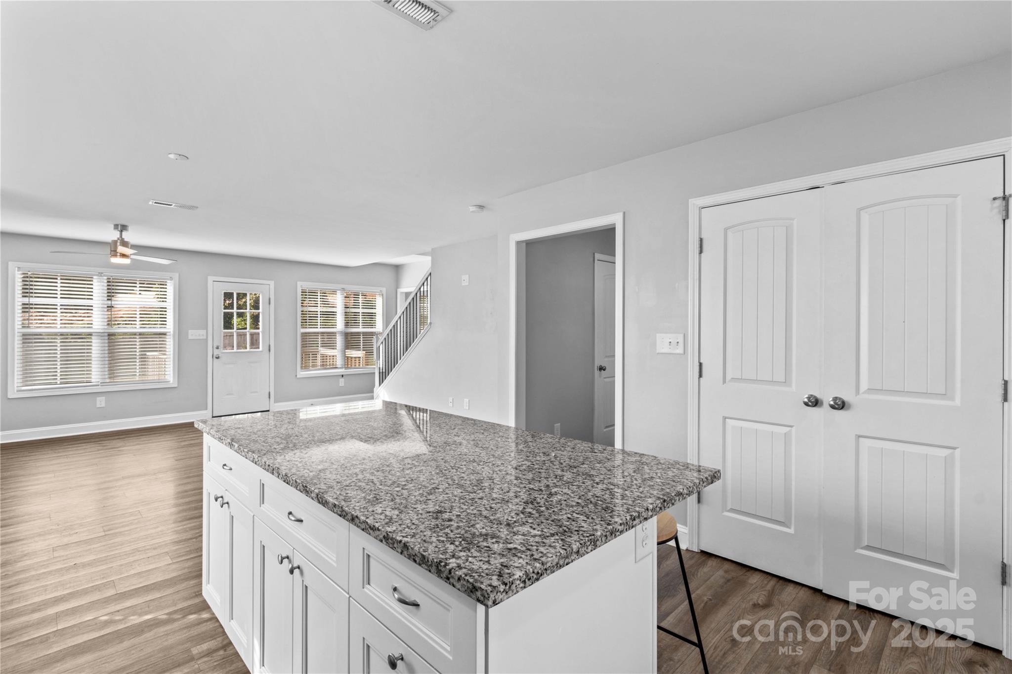 2518 Moose Road Kannapolis, NC 28083 - Photo 18 of 47 a kitchen with granite countertop granite countertop a sink and dishwasher with wooden floor